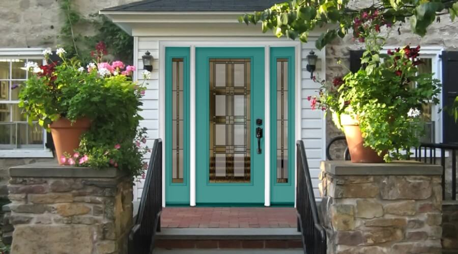 a teal front entry door to a house