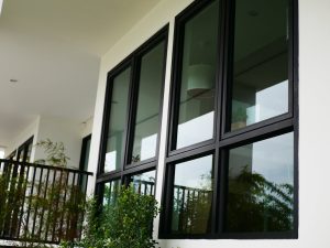 an exterior of a house with black windows and black window frames