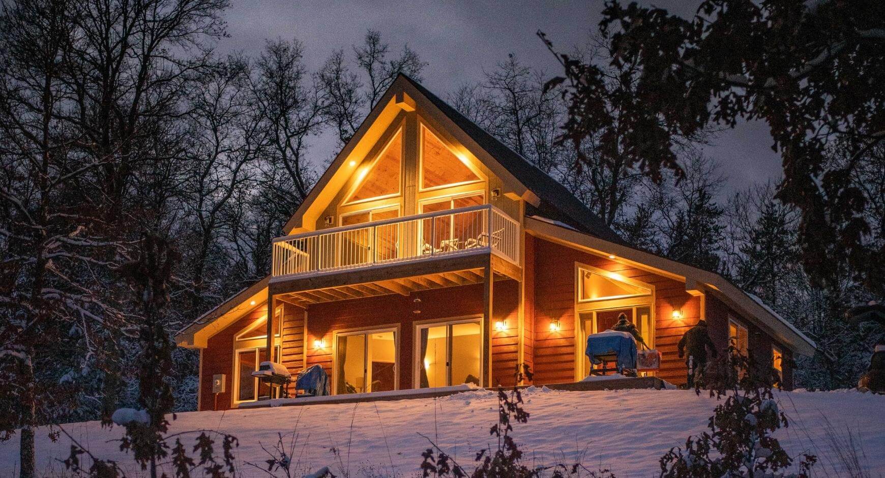 well lit home on a winter night