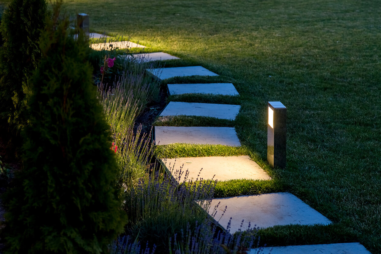 a lit backyard path
