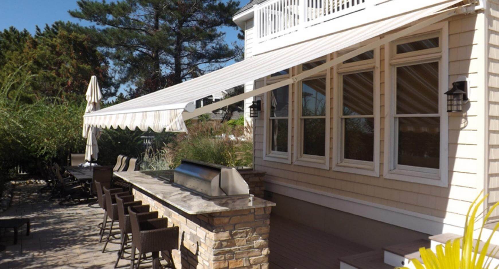 Awning covered outdoor bar and grill