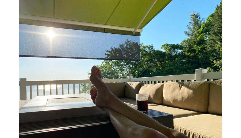 someone lounging on a furnished deck