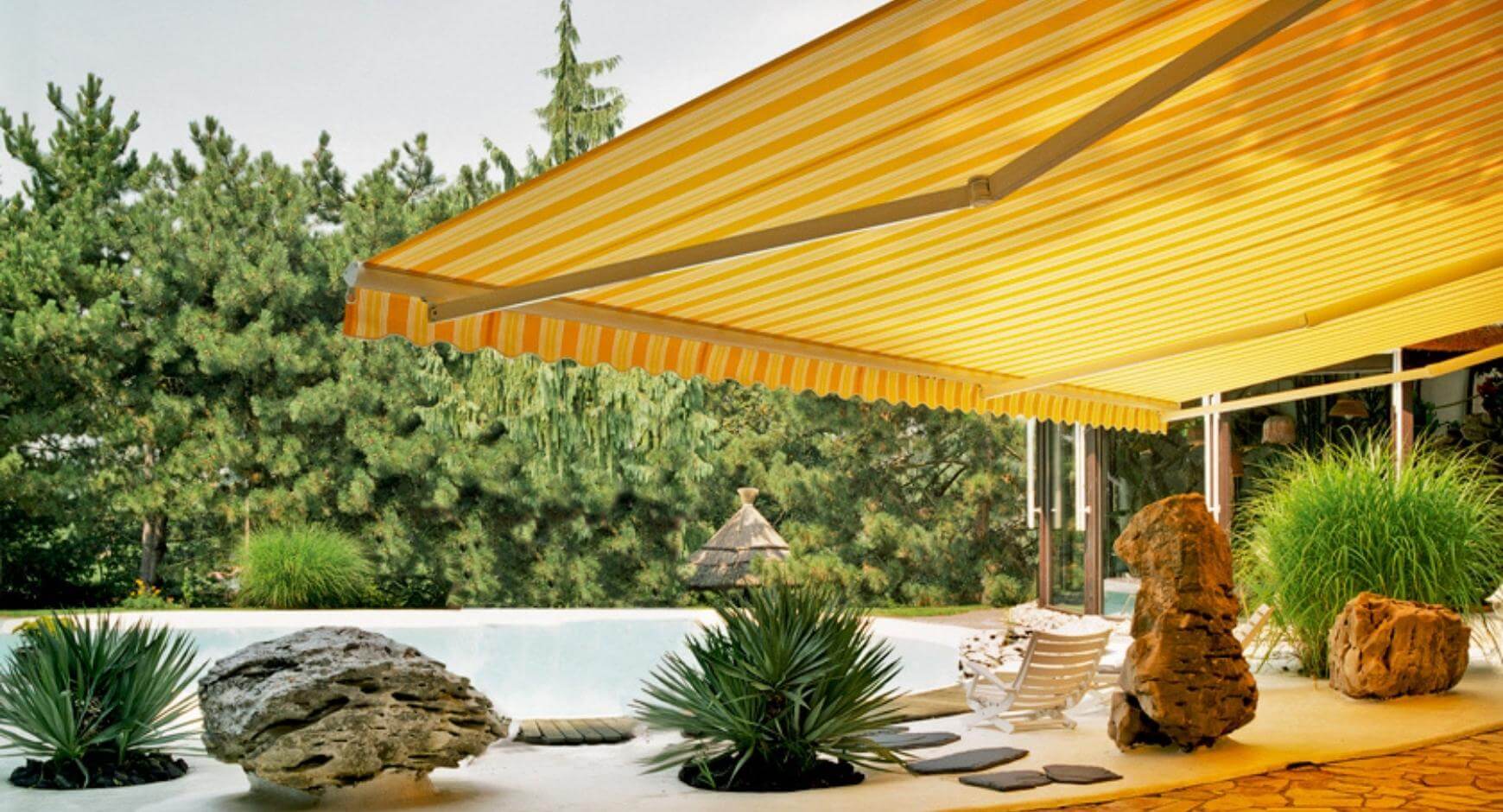 bright yellow awning over rock garden