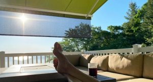 relaxing on the porch under a retractable awning