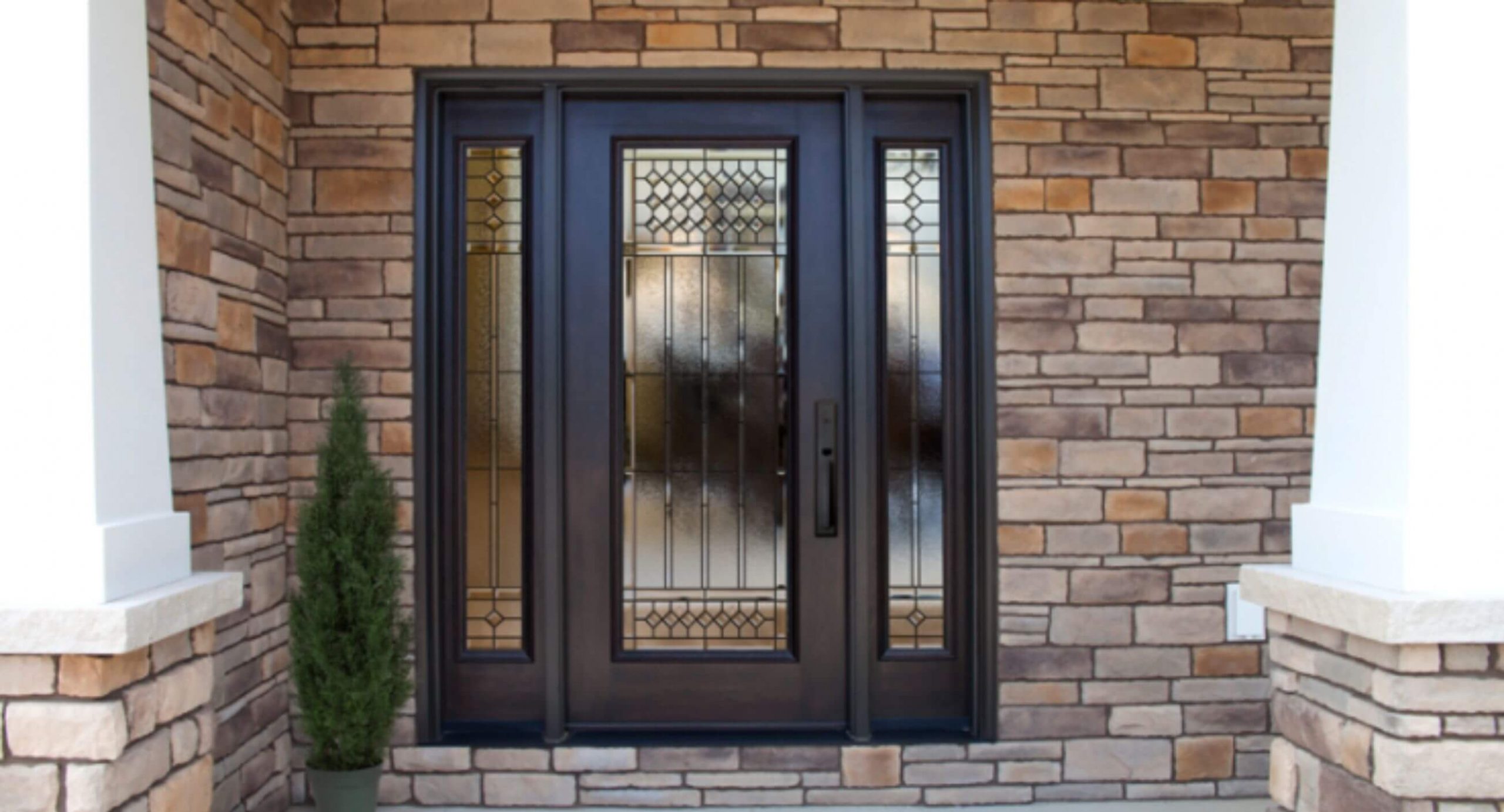 Steel door set in stone facade home