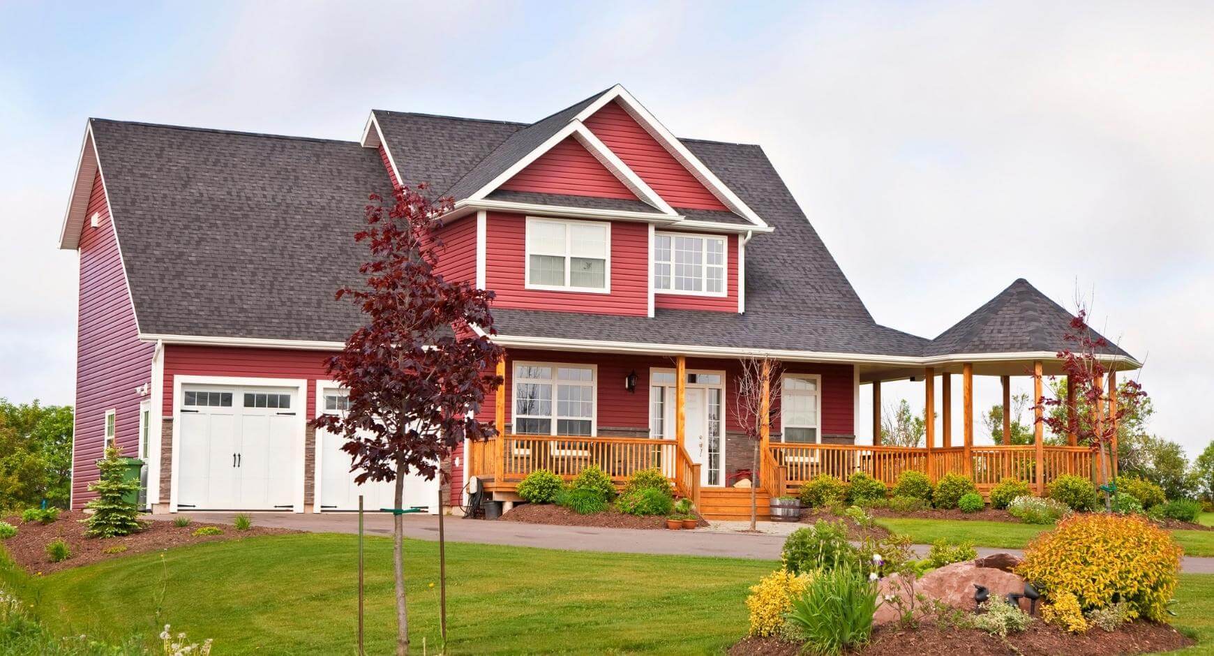 Autumn red house with white trim