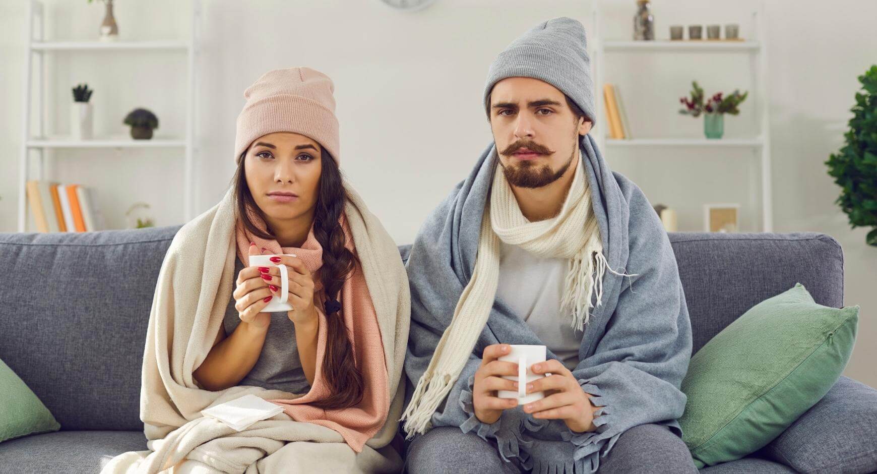 couple in warm clothes inside