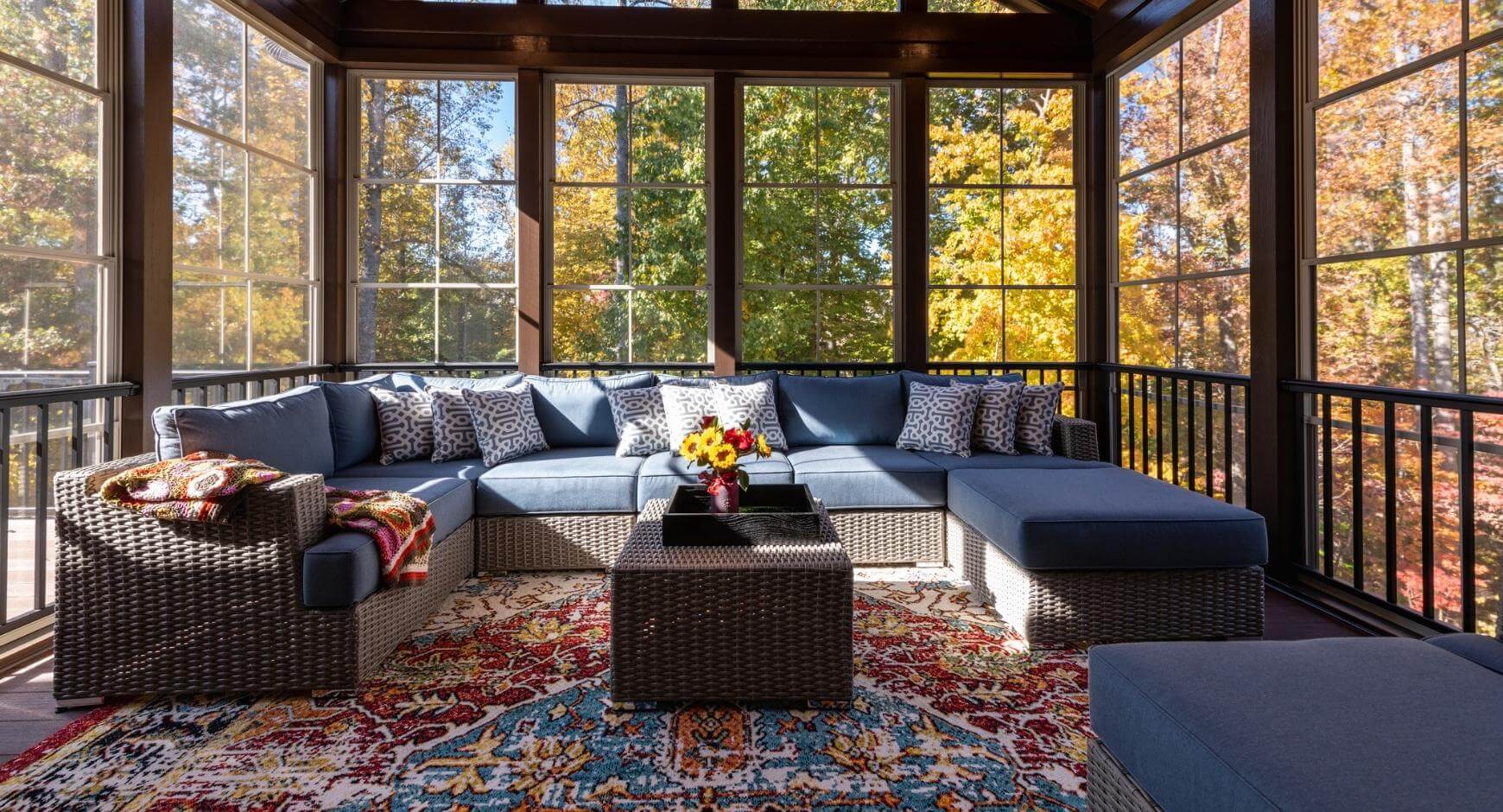 Wrap around couch in an open sunroom
