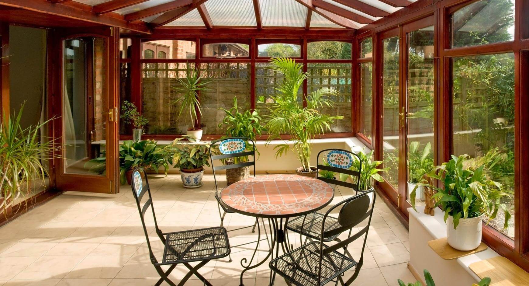 Glass sunroom filled with plants