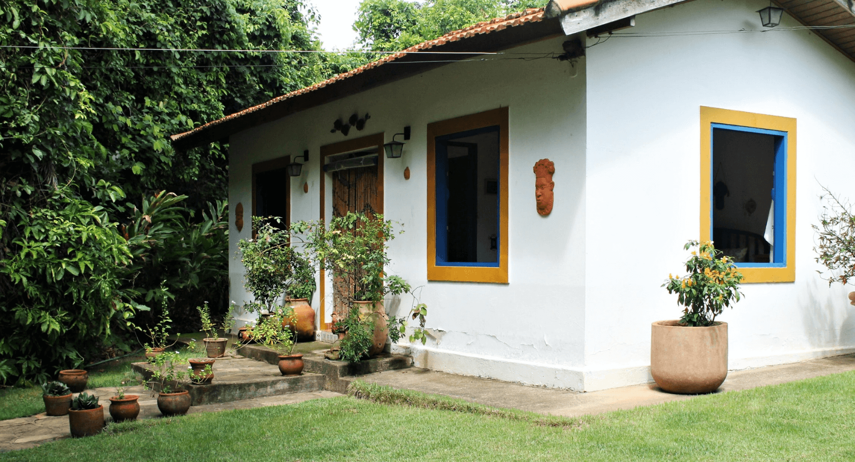 Image of a home with colorful, flat window trim