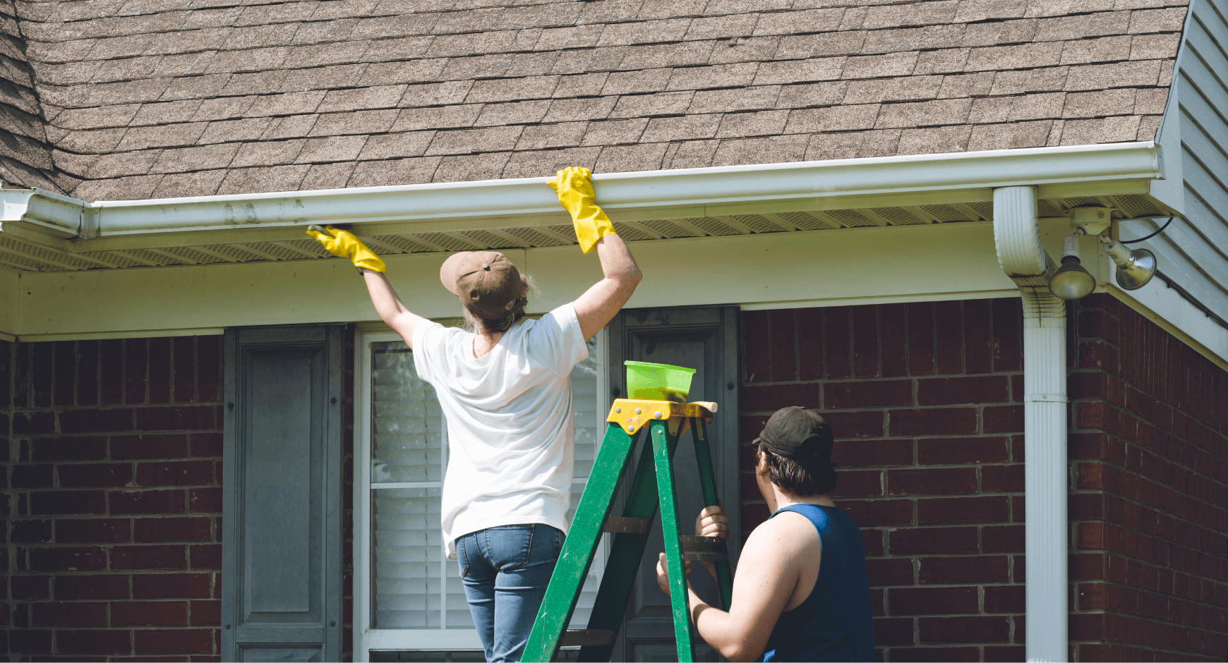 image of a woman repairing gutters