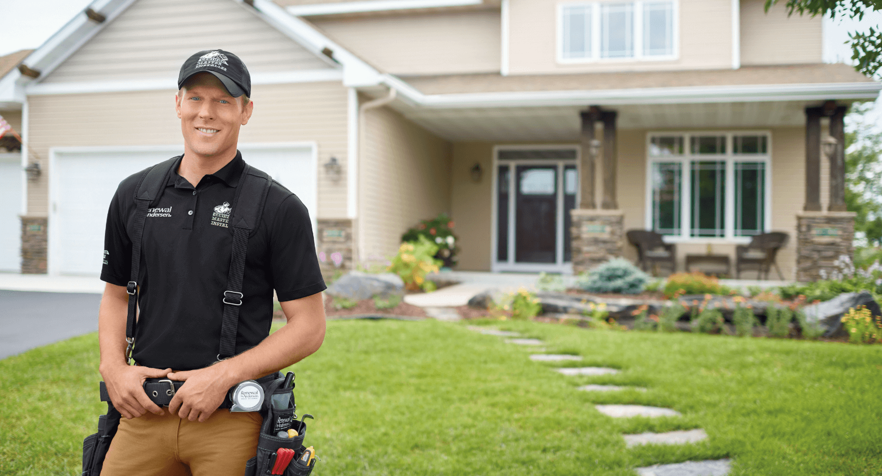 Image of a man standing in front of a home