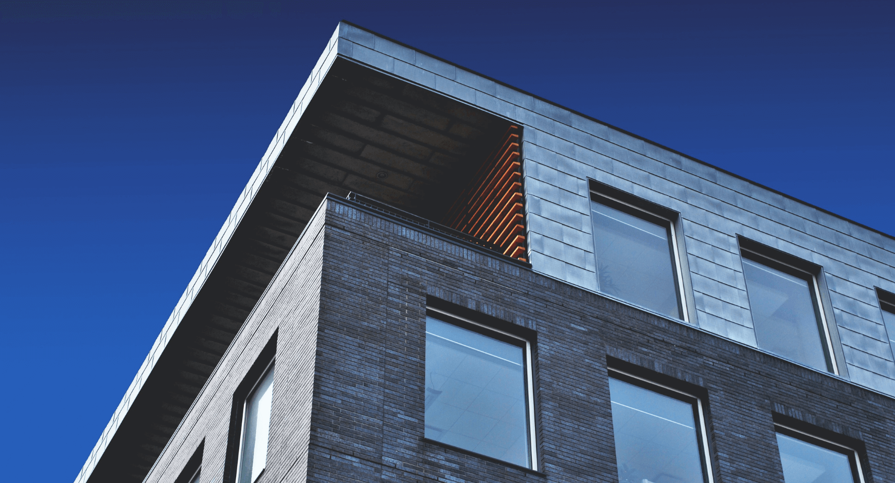 Image of a building with simple window trim