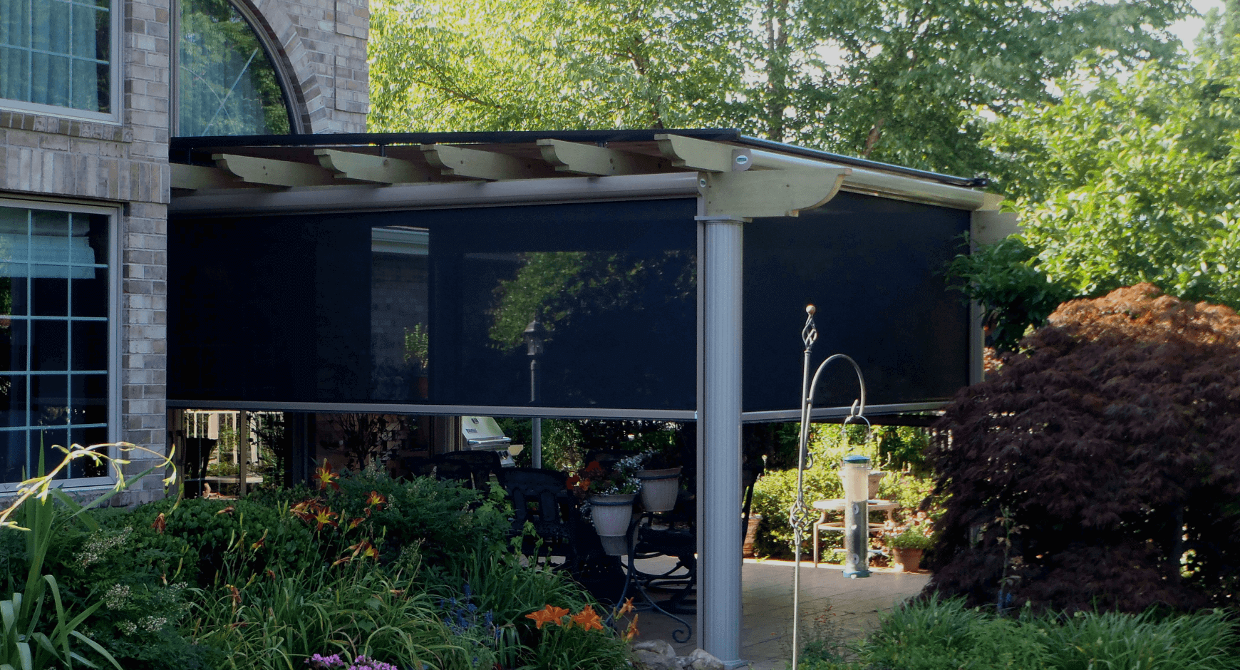 Wood pergola with sentry style solar screens