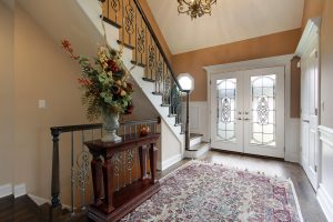 Foyer in suburban home with leaded glass doors