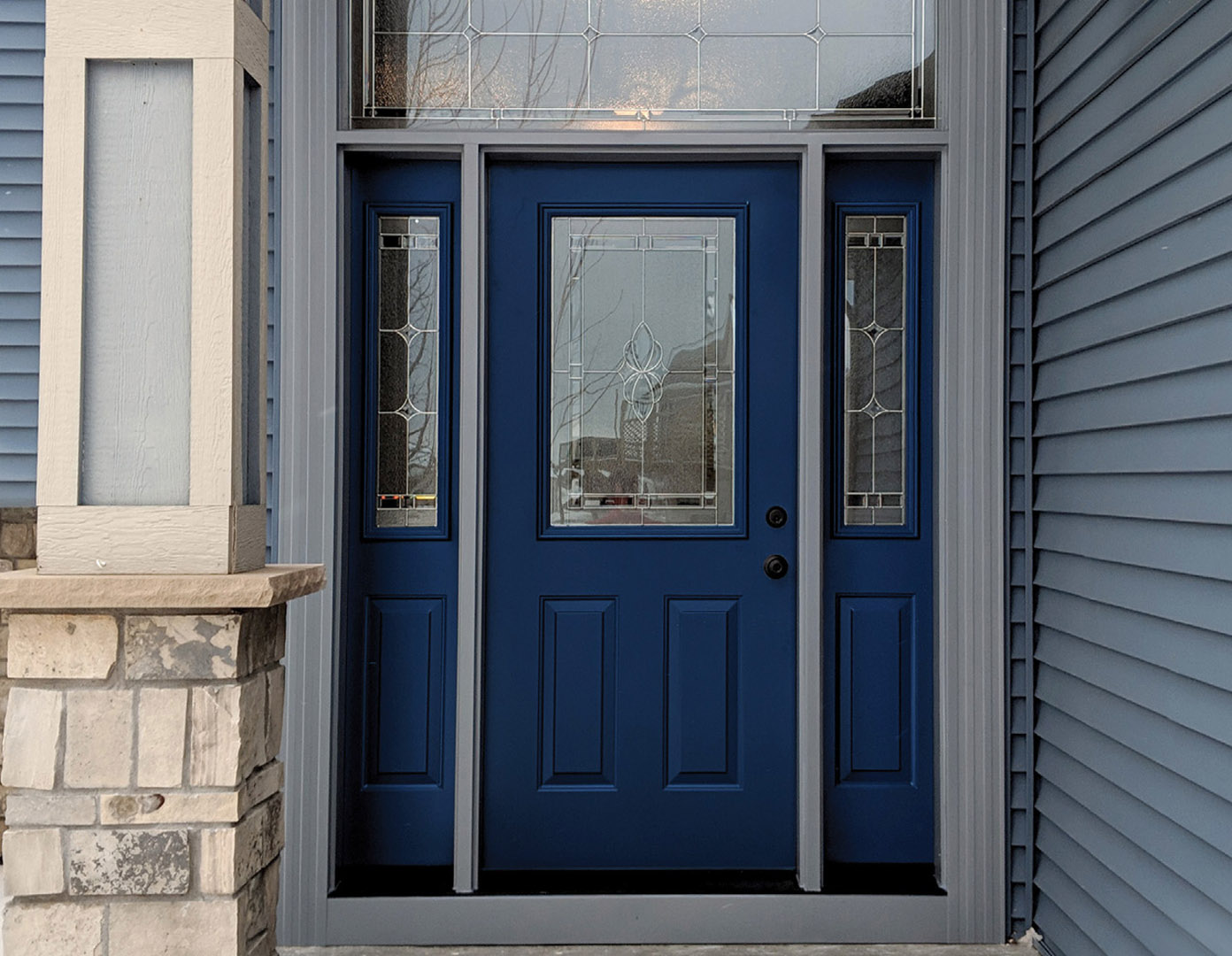 a deep blue front entry door to a home