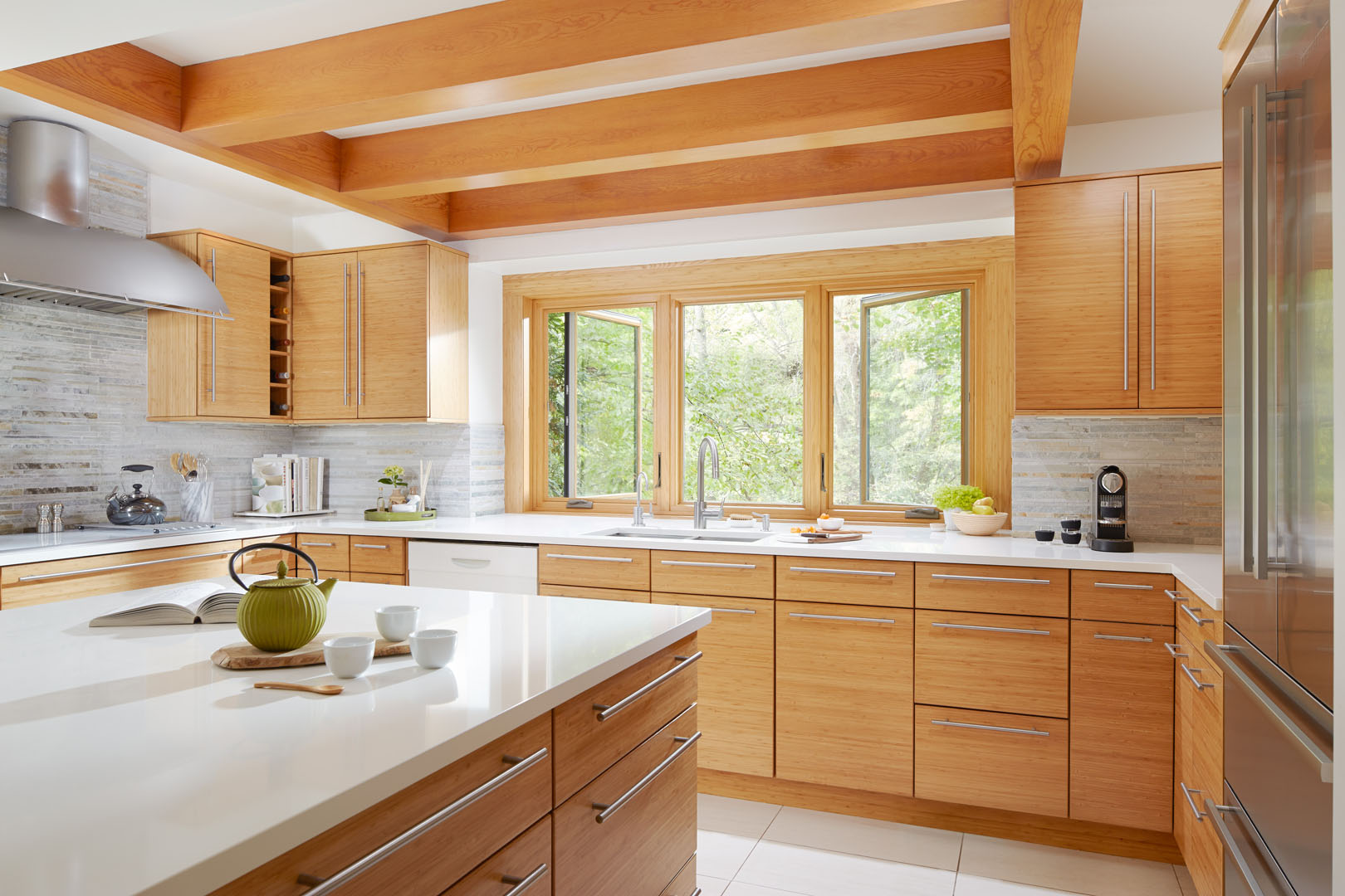 a kitchen with Renewal by Andersen casement windows letting in natural light