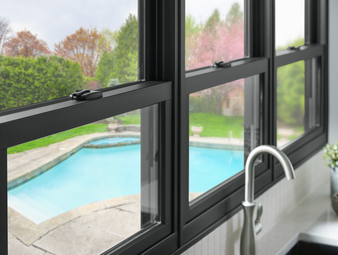 double hung windows in a kitchen above a sink