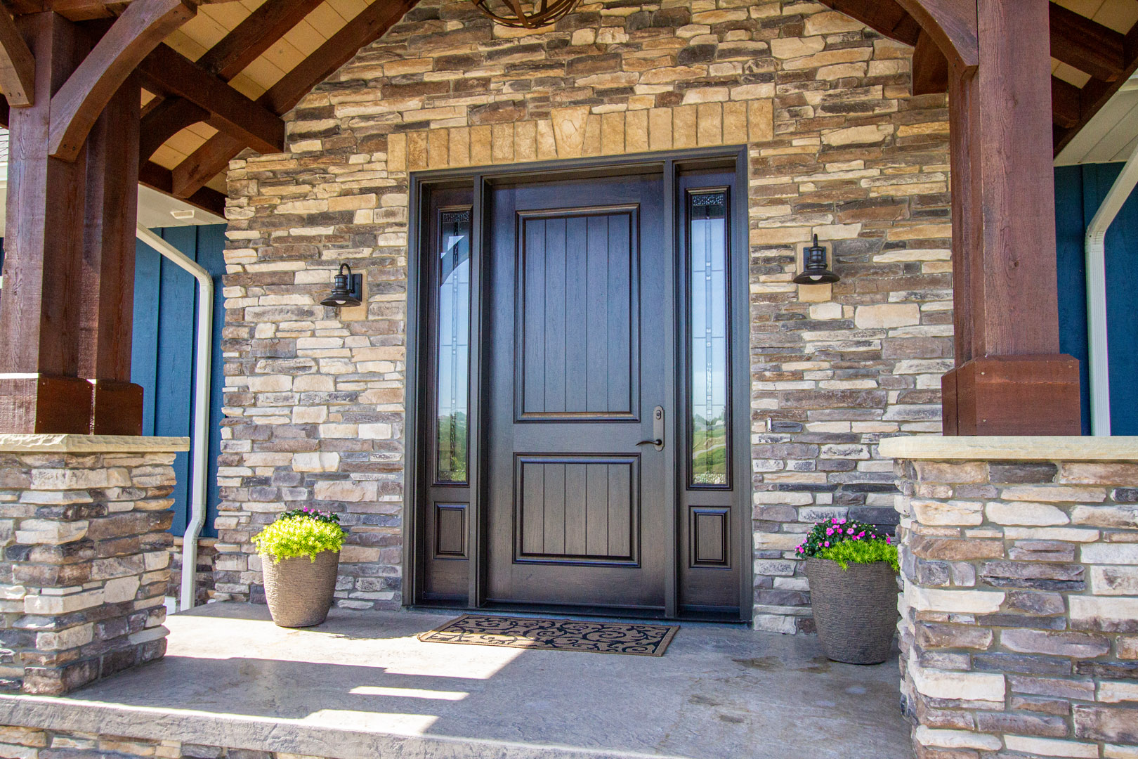 a brown mahogany front entry door to a home