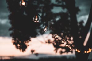 a string of lights that are turned on during the sunset