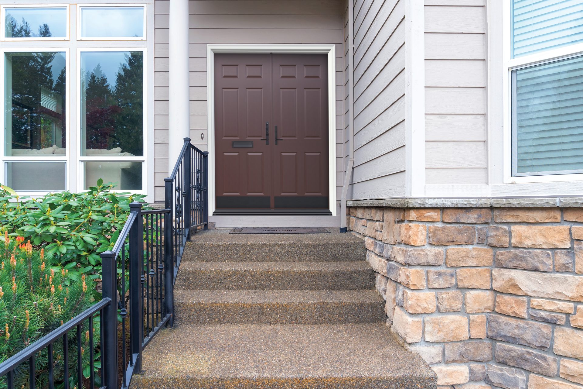 Solid double entry door leading into a home