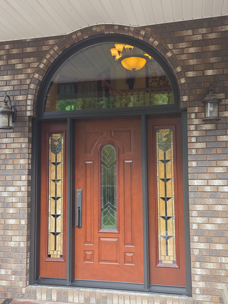 orange exterior door with rose side panels and half circle window above