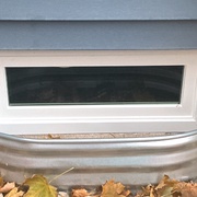 narrow window installed for basement in Holmen